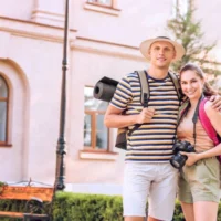 depositphotos_417615074-stock-photo-couple-tourists-city-street 